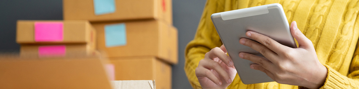 Woman using a tablet to get a freight quote
